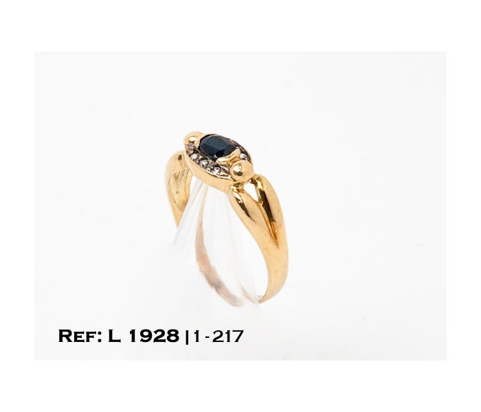 1-1-217-1-Anillo oro 18Kt. con piedra tipo zafiro y circonitas L1928