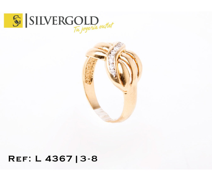 1-3-8-1-L 4367 Anillo en forma de lazo gallonado con diagonal de zirconitas. Oro 18 Kt. Talla 23.