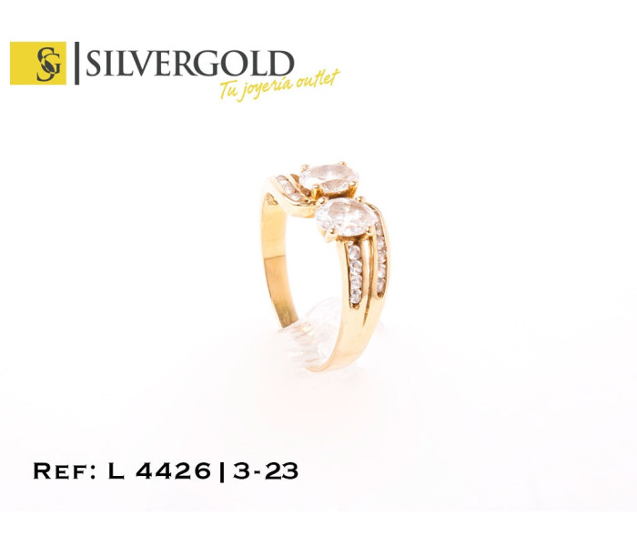 1-3-23-1-L 4426 Anillo estilo tú y yo con zirconitas talla oval y zirconitas a los lados. Oro 18 Kt. Talla 13
