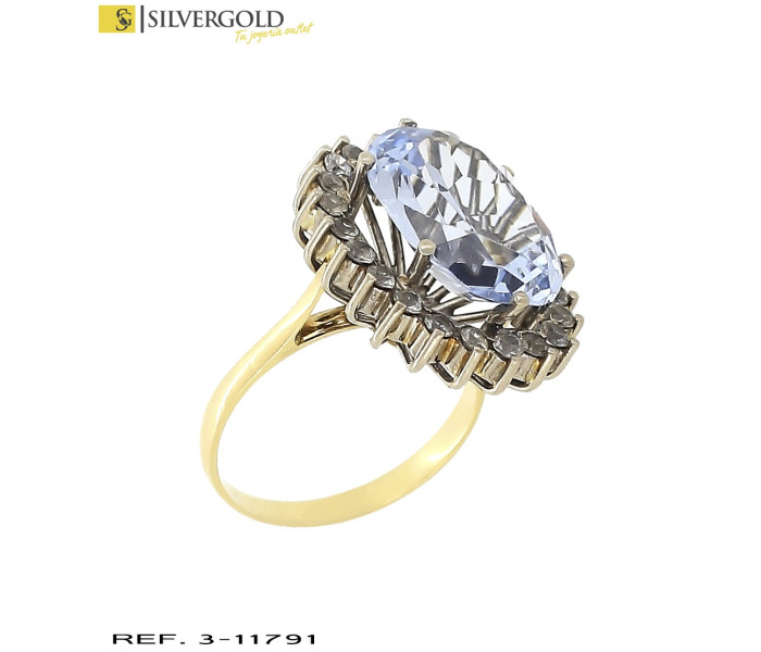 4-3-11791-1-AnilloT13 con piedra celeste oval facetada en altura con orla con detalle en oro blanco y zirconit